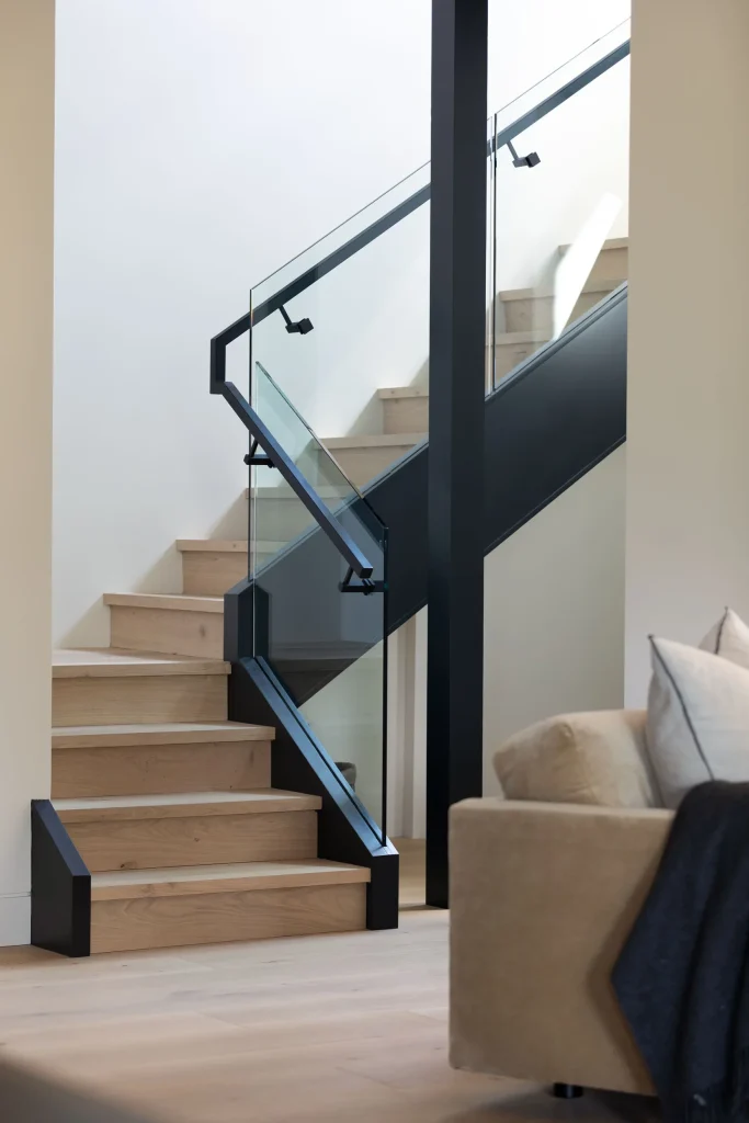 Hardwood staircase and flooring on the Sun Ridge project by Tantalus Floors