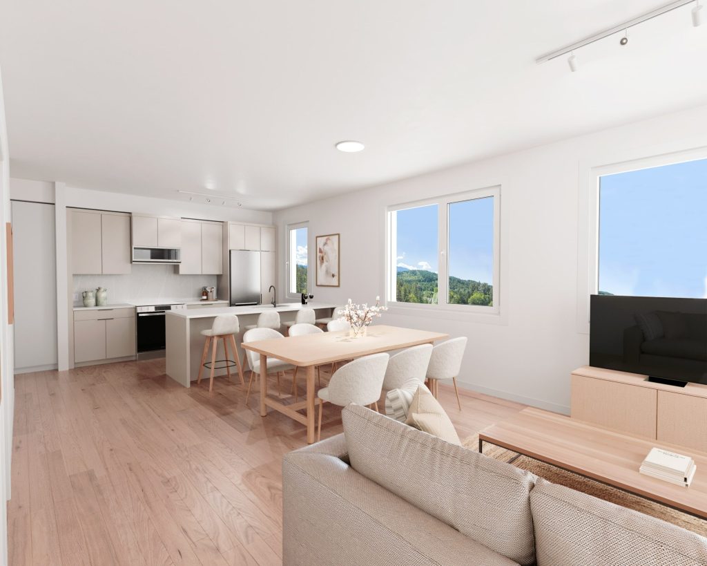 Open-plan living, dining, and kitchen with light engineered hardwood flooring and mountain views in a Squamish show home — Tantalus Floors